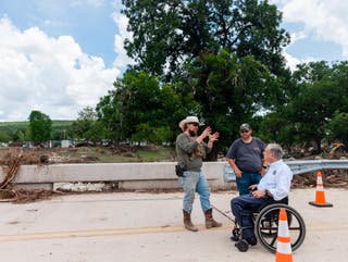 The governor visited Big Sandy Creek on Monday to survey damage and meet locals